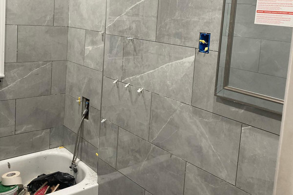 A bathroom with a shower and tub, providing a relaxing and refreshing space for personal hygiene.